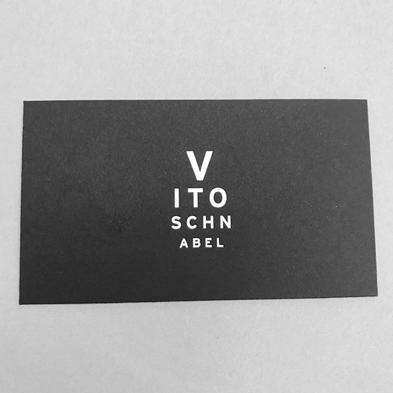 Assorted black business cards with foil and white ink