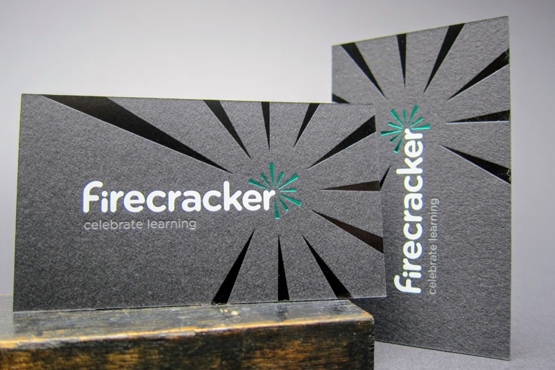Starburst rays die cut through black business cards