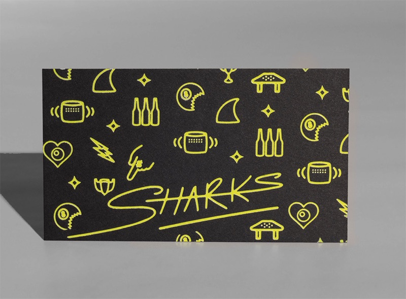 Fluorescent yellow icons on black business card