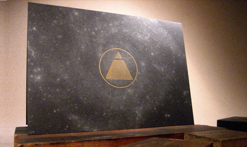 Gold and silver ink celestial invitation on black paper