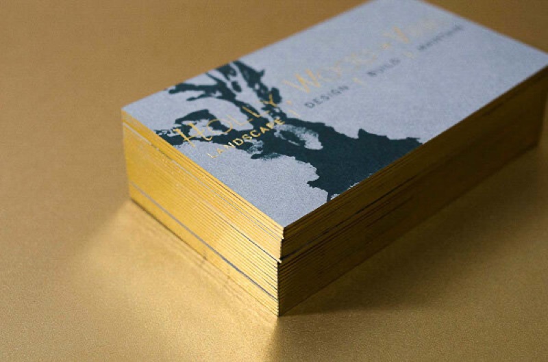 Gold gilded edge business cards stacked