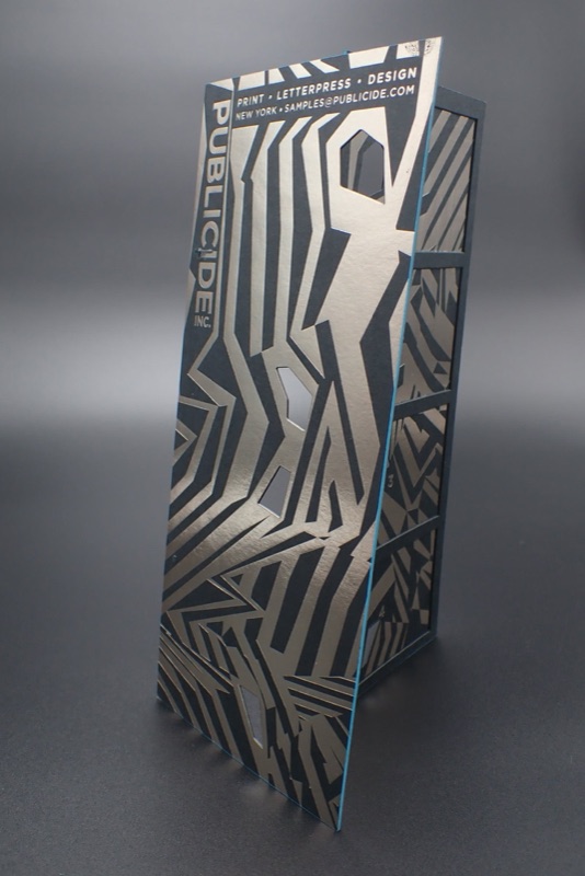 Gunmetal foil pattern on black packaging
