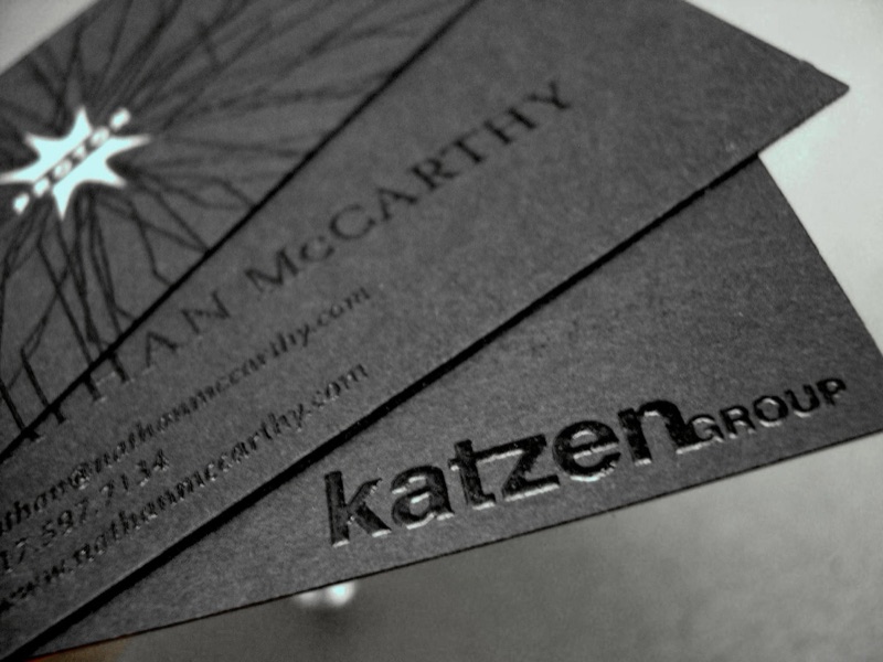 Raised black thermography on black business cards