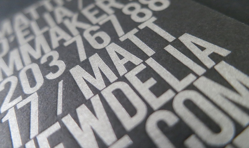 Silver metallic letterpress type on charcoal card