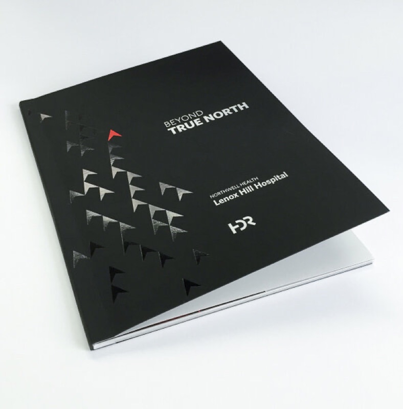 Spot UV triangles on black report cover