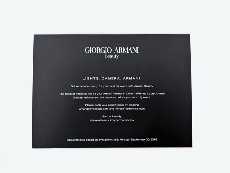 White ink invitation on black paper