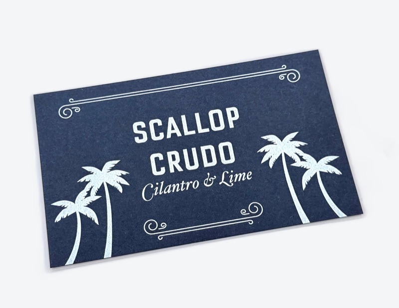White ink menu card on navy stock